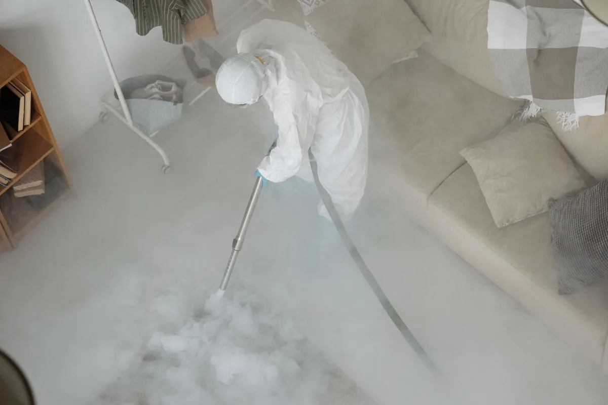 Biohazard cleanup technician in protective equipment, Tomah, WI